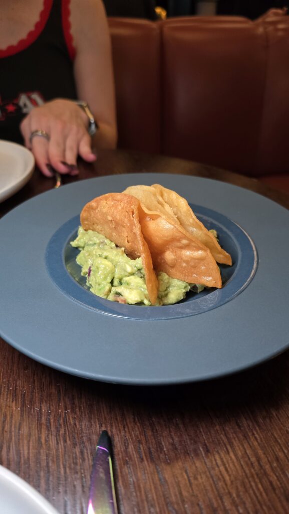 guac and chips served at Pink Agave on Virgin Voyages Scarlet Lady cruise ship