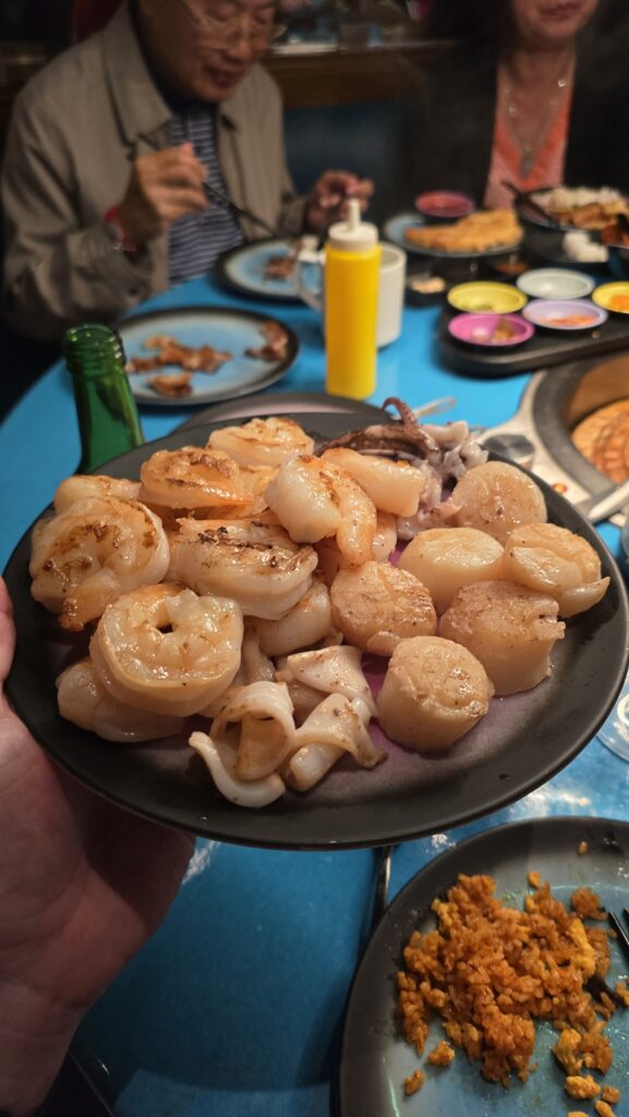 grilled seafood served at Gunbae on Virgin Voyages Scarlet Lady cruise ship