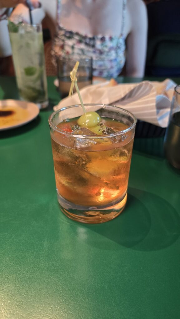 Godfather whiskey cocktail served at Extra Virgin on Virgin Voyages Scarlet Lady cruise ship