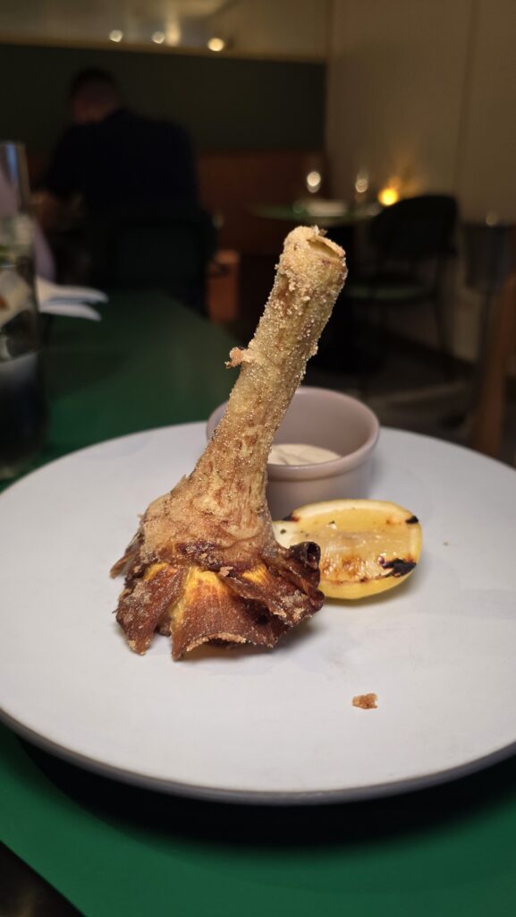 fried artichoke served at Extra Virgin on Virgin Voyages Scarlet Lady cruise ship