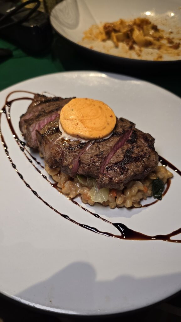 New York Strip Steak at Extra Virgin on the Virgin Voyages Scarlet Lady Cruise Ship.